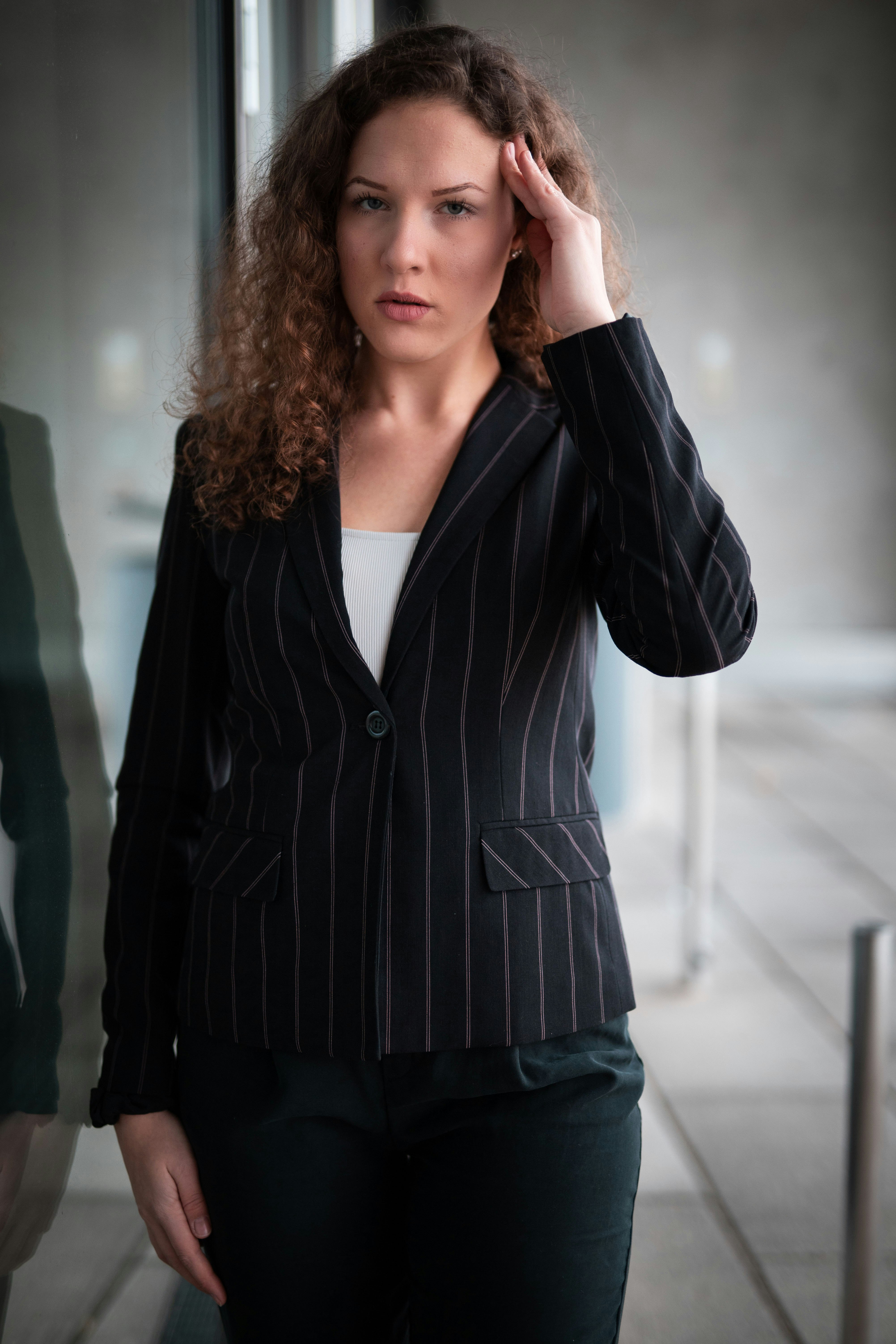 woman in black and white striped blazer